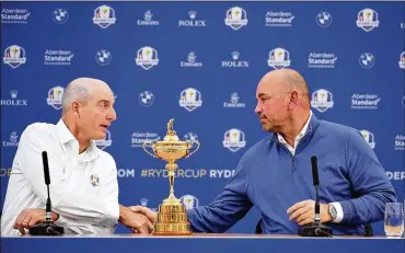  ?? STUART FRANKLIN / GETTY IMAGES ?? U.S. captain Jim Furyk (left) shakes hands with European counterpar­t Thomas Bjorn during Monday’s introducto­ry news conference ahead of the 42nd Ryder Cup at Le Golf National in Paris.