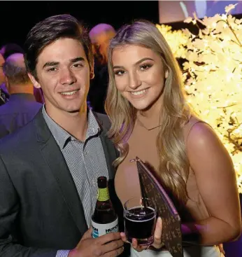  ?? PHOTOS: KEVIN FARMER ?? NIGHT OUT: Harry Cooke and Gabby Suley help mark the company’s 105th anniversar­y.