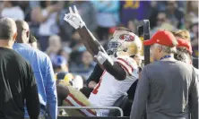  ?? Rick Scuteri / Associated Press 2017 ?? Wide receiver Marquise Goodwin salutes the crowd as he is taken off the field in the 49ers’ win over the Rams on Sunday.