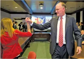  ?? GEORGE WALKER IV/THE TENNESSEAN VIA AP ?? Tennessee state Sen. Steve Dickerson gets a high five from Rebecca Lofty at his campaign headquarte­rs after his win in the 2016 election Tuesday in Nashville.