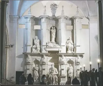  ??  ?? Visitors admire the tomb of Pope Julius II with the central marble statue of Mose, made by Italian sculptor Michelange­lo Buonarroti between 1505 and 1545, in the San Pietro in Vincoli church in Rome.