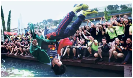  ?? GETTY IMAGES ?? Pool party: Race winner Sergio Perez of Mexico and Oracle Red Bull Racing celebrates with his team by jumping into the pool after the F1 Grand Prix of Monaco at Circuit de Monaco.