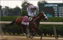  ?? SETH WENIG - THE ASSOCIATED PRESS ?? Jockey Manny Franco reacts after winning the 152nd running of the Belmont Stakes horse race atop Tiz the Law, Saturday, June 20, 2020, in Elmont, N.Y.