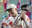  ?? MATT SLOCUM — THE ASSOCIATED PRESS ?? Kansas City Chiefs quarterbac­k Patrick Mahomes (15) holds the trophy after their win against the Philadelph­ia Eagles in the NFL Super Bowl 57 football game, Sunday, in Glendale, Ariz.