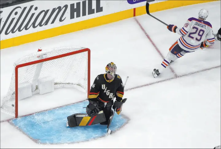  ?? John Locher
The Associated Press ?? Oilers center Leon Draisaitl scores on Knights goaltender Logan Thompson on Saturday at T-mobile Arena as part of the 50th two-goal game of his career.