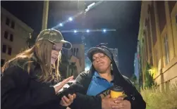  ?? MARK HENLE/THE REPUBLIC ?? Liz DaCosta with Community Bridges, left, completes a survey while talking to Natasha Castillo during Maricopa County’s annual Point-in-Time count near Fourth Avenue and Monroe Street in Phoenix last year.