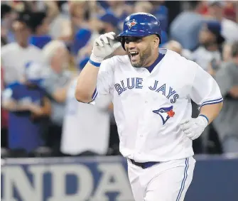  ?? NATHAN DENETTE, THE CANADIAN PRESS ?? Blue Jays DH Kendrys Morales celebrates as he rounds the bases after his walk-off solo home run during ninth inning in Toronto on Wednesday.