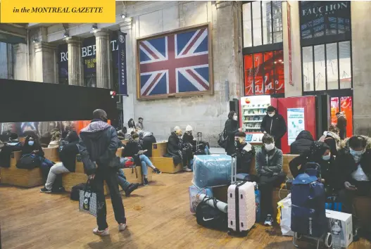  ?? LEWIS JOLY / THE ASSOCIATED PRESS ?? Passengers wait at Gare du Nord train station in Paris on Monday. France is banning all travel from the U.K. for 48 hours over new strain of the coronaviru­s. Story on page NP4.