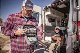  ?? Photograph: Shane Brown/Native News Online ?? Coleman Cox shows items offered at the Cherokee Nation harm-reduction van in Vinita, Oklahoma, on 7 November 2023.