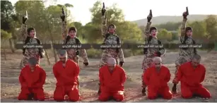  ??  ?? YOUNG ISLAMIC STATE followers prepare to execute Kurdish fighters from the YPG People’s Protection Units in a video the terrorist organizati­on released on October 26, 2016.