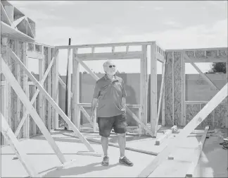  ??  ?? Richard Plaster is president of Signature Homes, which has a new developmen­t under constructi­on in North Las Vegas. He is setting aside about a half-dozen homes in the subdivisio­n for young buyers with modest incomes, who will be able to get assistance from a state program because, he said, it’s the right thing to do.