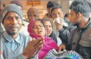  ?? PTI ?? Family members of the victims who fell critically ill after consuming spurious liquor wait outside a hospital in Saharanpur on Saturday.