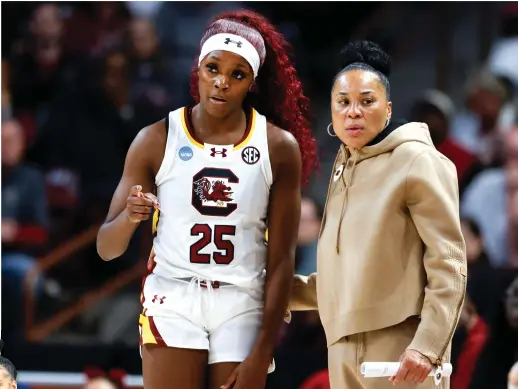  ?? NELL REDMOND/AP, STEPH CHAMBERS/GETTY IMAGES ?? Dawn Staley (above, right) and South Carolina are heavy favorites to win the national championsh­ip. Aziaha James (inset) leads an N.C. State squad that’s making its first Final Four appearance since 1998.