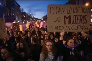  ?? AP Photos/Emilio Morenatti ?? Women's March: Women march as they shout slogans during the Internatio­nal Women's Day in Barcelona, Spain, Thursday. Spanish women are marking Internatio­nal Women's Day with the first-ever full day strike and dozens of protests across the country...