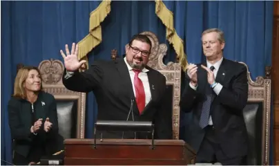  ?? NICOLAUS CZARNECKI / HERALD STAFF FILE ?? HELPING HAND: Former New England Patriot Joe Andruzzi gives the keynote address during the Sweeney Award presentati­on at the State House last year. Also seen are Gov. Charlie Baker, right, and Lt. Gov. Karyn Polito.