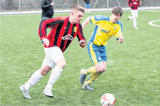  ??  ?? Craig Sylvester and ex-Abercynon midfielder Joe Meeke tussle for the ball