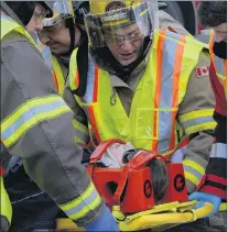  ?? JOE GIBBONS/THE TELEGRAM ?? Mock accident student actor Elizabeth Johnson is placed on a stretcher and “rushed” to the Health Sciences Centre emergency department with “trauma” injuries.