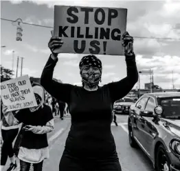  ??  ?? A PLEA FOR CHANGE
A protester in Detroit, May 30th. Advocates are calling for new ways to approach public safety.