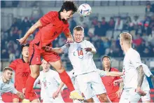  ?? Yonhap ?? Korea’s Cho Gue-sung (9) goes for a header during the tuneup match against Iceland at Hwaseong Sports Complex Main Stadium in Hwaseong, Gyeonggi Province, Friday.