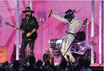  ??  ?? US rapper Lil Nas X (right) and US singer-songwriter Billy Ray Cyrus perform onstage.