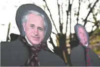  ?? STAFF PHOTO BY ANGELA LEWIS FOSTER ?? Cardboard cutouts of Sen. Bob Corker, left, and Rep. Scott DesJarlais were on display during a rally Friday and are expected to return for town halls and protests locally throughout the week.