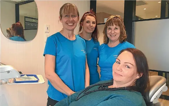  ??  ?? Rebecca of Kaiapoi with dentist Ali Peers, assistant Chloe O’Callaghan and receptioni­st Rose Kugener.