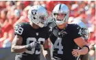  ?? KIM KLEMENT, USA TODAY SPORTS ?? Amari Cooper, left, and Derek Carr had big days for the Raiders.