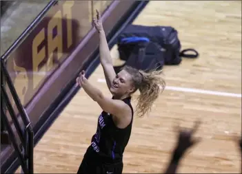  ?? AP Photo/Chuck Burton ?? BYU’s Paisley Harding (13) looks toward fans as she celebrates after BYU defeated Rutgers in a college basketball game in the first round of the women’s NCAA tournament at the University Events Center in San Marcos, Texas, on Monday.