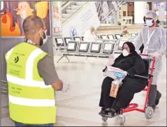  ?? Photo by Mohammad Morsi ?? A Kuwaiti woman on wheelchair being received at the Kuwait airport.