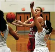  ?? BOB RAINES — DIGITAL FIRST MEDIA ?? Upper Dublin’s Josie Barrett throws up a shot past Cheltenham’s Caitlin Wallace Jan. 19, 2016.