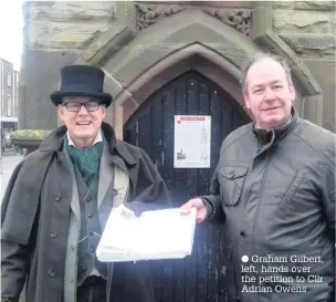  ??  ?? Graham Gilbert, left, hands over the petition to Cllr Adrian Owens