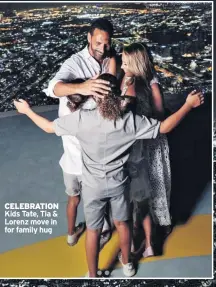  ??  ?? CELEBRATIO­N Kids Tate, Tia &amp; Lorenz move in for family hug