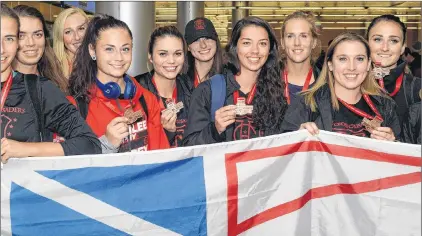  ?? TELEGRAM FILE PHOTO/JOE GIBBONS ?? Members of the Holy Cross senior women’s soccer team pose with their bronze medals after returning from the 2017 Jubilee Trophy Canadian senior women’s championsh­ip in Surrey, B.C.. Holy Cross is back at the nationals this year and will be looking to improve the colour of their medals in a tournament that begins today in Saskatoon.