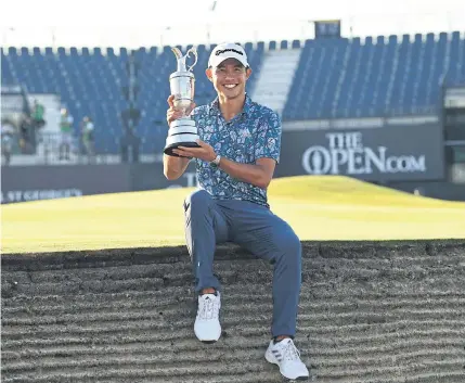  ?? AFP ?? Collin Morikawa celebrates with the Claret Jug after winning the British Open at Royal St George’s on Sunday.