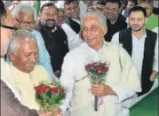  ?? SANTOSH KUMAR/HT PHOTO ?? ■
RJD leader Jagdanand Singh being greeted after filing his nomination for the top party post in Bihar. Leader of Opposition Tejashwi Yadav is also seen.