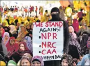  ??  ?? Women hold a placard during the sit-in protest against the NPR, the NRC and the CAA, in New Delhi on February 26 HT PHOTO