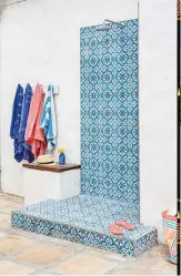  ??  ?? Just beyond the stoep is an outdoor shower on a small platform (below) where the Oslers can rinse off their sandy feet after a day at the beach.
Tiles from Moroccan Warehouse laid by Fred Retief of Disa Renovation­s