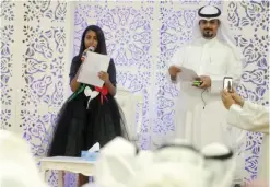  ??  ?? KUWAIT: Young Kuwaiti journalist Ghalyah Talal Al-Ghannam delivers a national poem. — KUNA