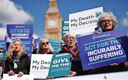  ?? Jordan Pettitt/Press Associatio­n ?? Campaigner­s in support of voluntary euthanasia protest outside Parliament in Westminste­r, London, ahead of a debate in the House of Commons on assisted dying. A petition for a debate gained more than 200,000 signatures and has been backed by Dame Esther Rantzen