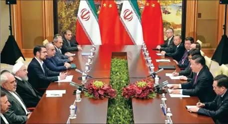  ?? WAN QUAN / FOR CHINA DAILY ?? President Xi Jinping meets Iranian President Hassan Rouhani on the sidelines of the 18th Shanghai Cooperatio­n Organizati­on Summit in Qingdao, Shandong province,
