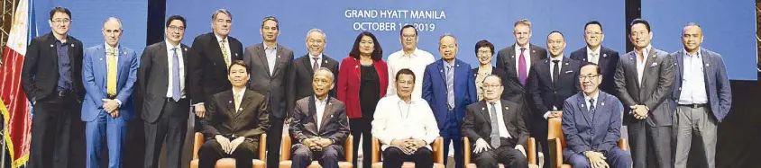  ??  ?? President Rodrigo Duterte with (seated, from left) EGCO Group SVP for business developmen­t Danuja Simasathie­n, Energy Secretary Alfonso Cusi, Meralco and Meralco PowerGen chairman Manuel V. Pangilinan and Meralco PowerGen president and CEO Rogelio Singson; (standing, from left) Meralco SVP for human resources Edgar Carasig, director Pedro Roxas, vice chairman Lance Gokongwei, Meralco PowerGen chief technical officer John Quirke, Smart president and former Meralco executive Alfredo Panlilio, Meralco president and CEO Atty. Ray Espinosa, Meralco PowerGen VP for external affairs Litz Santana, Meralco director Jose Ma. K. Lim, Meralco director and retired Supreme Court Chief Justice Artemio Panganiban, Meralco director Anabelle Chua, Meralco PowerGen EVP and COO Dan Neil, One Meralco Foundation president Jeffrey Tarayao, Meralco PowerGen SVP and SBPL president Marcos Yorobe, the author and Meralco VP for regulatory Jose Ronald Valles.