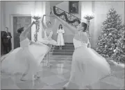  ??  ?? First lady Melania Trump watches as ballerinas perform a piece from “The Nutcracker” among the 2017 holiday decoration­s in the Grand Foyer of the White House in Washington.