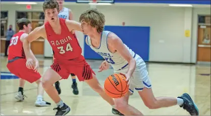  ?? Steven Eckhoff ?? Model’s Cole Mathis attacks on the offensive end against the Rabun County Wildcats in their Sweet 16 playoff game on Saturday, Feb. 27, at Model High School.