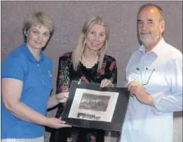  ??  ?? A print of Rosegarlan­d was presented to the library at the talk. From left: Susan Kelly of Wexford Library, Mary Stratton Ryan, and Kevin Freeney of Art In The Open.