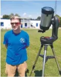  ?? CONTRIBUTE­D PHOTO ?? Dr. Michael Pugh with his telescope before the solar eclipse. No telescope or glasses are needed to see the Perseid meteor shower.