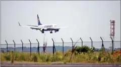  ?? ERIC FEFERBERG/AFP ?? A Ryanair plane lands at Beauvais airport in northern Paris.