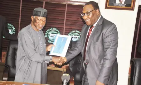  ??  ?? Comptrolle­r General of Nigeria Customs Service, retired Col. Hameed Ibrahim Ali (left)receives a document from the Executive Secretary/ CEO of the Nigerian Shippers' Council, Mr. Hassan Bello, when members of management of the service paid a courtesy...