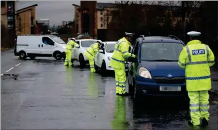  ??  ?? Cops carry out roadside checks in a bid to cut the rate of drink-driving in Scotland