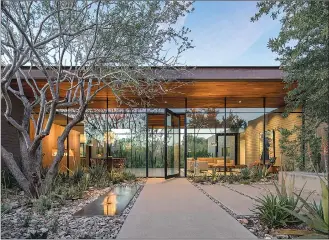  ?? Associated Press photos ?? This photo provided by Weddle Gilmore Black Rock Studio shows the entry courtyard of a residence located in Paradise Valley, Ariz.