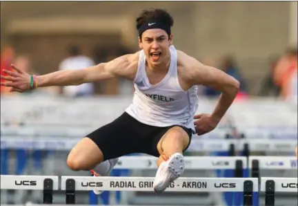  ?? DAVID TURBEN — THE NEWS-HERALD ?? Mayfield’s Bobby Casey wins 110 hurdles April 13 during the South Invitation­al. Casey set the area long jump record earlier in the meet.